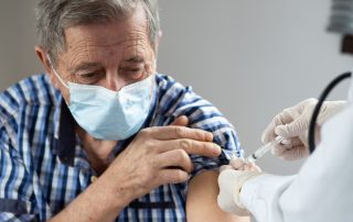 Man receiving the Covid-19 vaccine