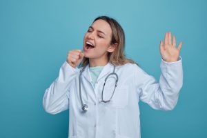A doctor pretends to sing